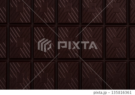 Dark chocolate bar texture background with geometric pattern 135816361