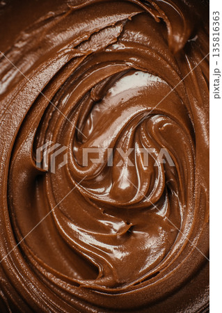 Creamy melted chocolate swirl texture background Creamy melted chocolate swirl texture background 135816363