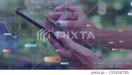 Displaying woman investor tapping touchscreen device against green backdrop, with live stock data 135816780