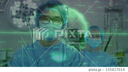 Reviewing patient vitals surgeon with glasses scanning monitor screens and data overlays in OR Reviewing patient vitals surgeon with glasses scanning monitor screens and data overlays in OR 135817014