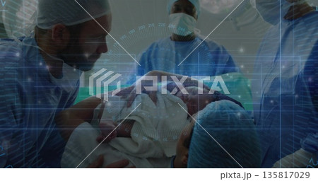 Placing newborn infant wrapped in hospital blanket on mother chest in operating suite, with drapes Placing newborn infant wrapped in hospital blanket on mother chest in operating suite, with drapes 135817029