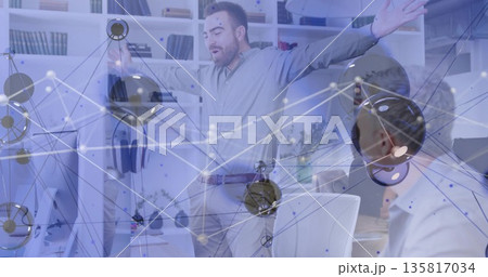 Gesturing office worker wearing button-up shirt spreading arms in office, with network overlay 135817034