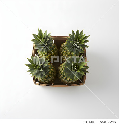 Pineapple Fruit Four Pineapples in Crate Overhead View 135817245