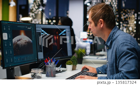 Game developer utilizes AI generated program to design spaceship station using deep learning, futuristic environment enhanced by machine learning solutions and cloud computing. Camera B. Game developer utilizes AI generated program to design spaceship station using deep learning, futuristic environment enhanced by machine learning solutions and cloud computing. Camera B. 135817324