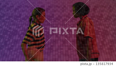 Facing women holding basketball in studio wearing striped red polo shirts with binary-code backdrop Facing women holding basketball in studio wearing striped red polo shirts with binary-code backdrop 135817934