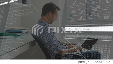 Working developer at office desk typing code on laptop with code overlay graphics, copy space 135818002