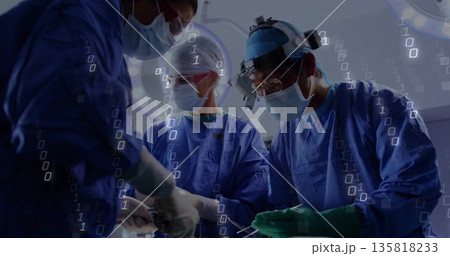 Three surgeons wearing scrubs performing surgery in operating room, with binary overlay Three surgeons wearing scrubs performing surgery in operating room, with binary overlay 135818233