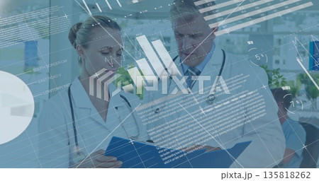 Doctors reviewing blue patient folder and digital charts in clinic, with stethoscopes Doctors reviewing blue patient folder and digital charts in clinic, with stethoscopes 135818262
