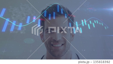 Smiling doctor wearing lab coat and stethoscope in studio with candlestick bars and line graph 135818392