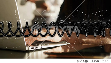 Typing mid adult Asian woman wearing long-sleeve top in office, with laptop tablet waveform overlay Typing mid adult Asian woman wearing long-sleeve top in office, with laptop tablet waveform overlay 135819642