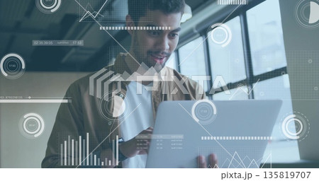 Holding laptop, tech professional analyzing floating data overlays inside office, visualization Holding laptop, tech professional analyzing floating data overlays inside office, visualization 135819707