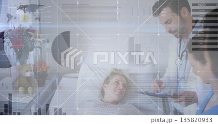 Reclining female patient wearing hospital gown in hospital room, with teddy bear and digital charts Reclining female patient wearing hospital gown in hospital room, with teddy bear and digital charts 135820933