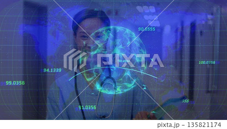 Standing nurse in scrubs analyzing holographic globe in hospital hall, with stethoscope tablet 135821174