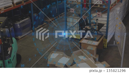Warehouse supervisor updating inventory at warehouse desk with forklift, laptop and packing foam Warehouse supervisor updating inventory at warehouse desk with forklift, laptop and packing foam 135821296