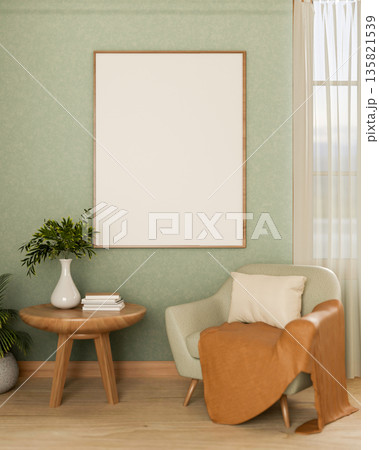 Empty white frame over leather sofa chair and side table on wooden parquet floor in green wall room. 135821539