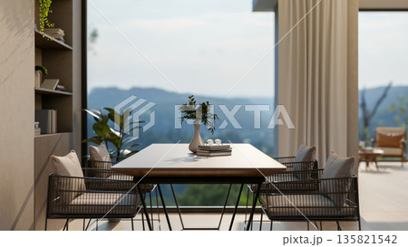 Wooden table and metal armchairs near bookshelf aside window wall and terrace with mountain scenery. Wooden table and metal armchairs near bookshelf aside window wall and terrace with mountain scenery. 135821542