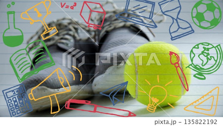 Resting black sneakers with socks at school beside yellow tennis ball with education sports doodles 135822192