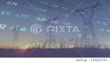 Overlaying financial numbers and arrows across steel towers and tall grasses in rural field at dusk 135822352