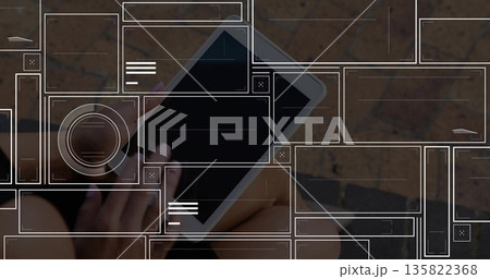 Holding tablet, woman wearing shorts sitting on stone plaza with semi-transparent UI overlays Holding tablet, woman wearing shorts sitting on stone plaza with semi-transparent UI overlays 135822368