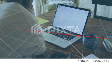 Working woman analyzing data on laptop at office, with coffee mug smartphone, overlay, copy space 135822445