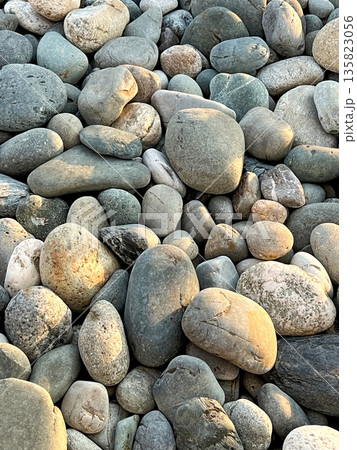 Background of pebbles on the sea coast Background of pebbles on the sea coast 135823056