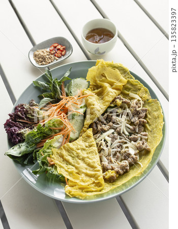 Banh xeo vietnamese traditional food pancake crepe with pork and salad in Vietnam 135823397