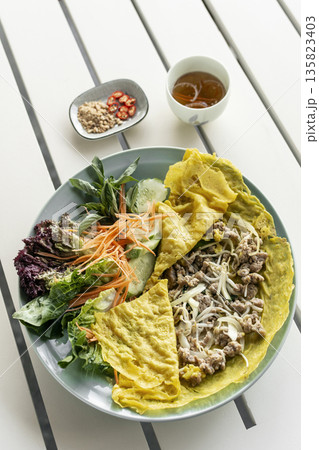 Banh xeo vietnamese traditional food pancake crepe with pork and salad in Vietnam 135823403