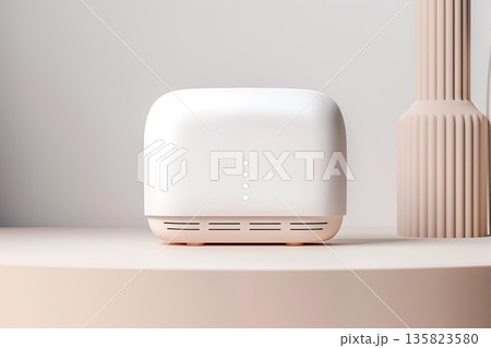 A smart home device is placed on a flat surface in a modern indoor setting with soft lighting. The device has a simple design with button indicators visible on the front 135823580