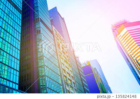 Skyscrapers bright glass exteriors sunlight on sunset. Facade office buildings in China, Hong Kong 135824148