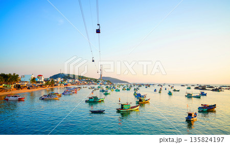 Cable car in Phu Quoc Island, Vietnam tourist area. Scenic view of waterfront village, cable cars Cable car in Phu Quoc Island, Vietnam tourist area. Scenic view of waterfront village, cable cars 135824197