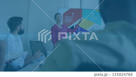 Presenting woman wearing blouse explaining infographic on screen in conference room with notebooks Presenting woman wearing blouse explaining infographic on screen in conference room with notebooks 135824768