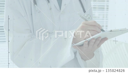 Writing notes medical worker wearing lab coat and stethoscope in medical office, with clipboard pen Writing notes medical worker wearing lab coat and stethoscope in medical office, with clipboard pen 135824826