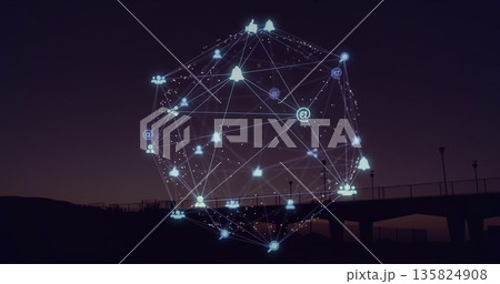 Floating holographic network sphere over sea pier with lampposts at dusk showing social media icons 135824908
