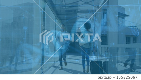 Walking male traveler crossing airport jet bridge, with paper coffee cup and crossbody bag Walking male traveler crossing airport jet bridge, with paper coffee cup and crossbody bag 135825067