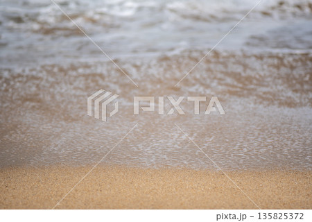 Gentle Waves on Sandy Beach 135825372