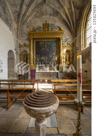 Ancient church interior Arles featuring baptismal font and altar Ancient church interior Arles featuring baptismal font and altar 135825693