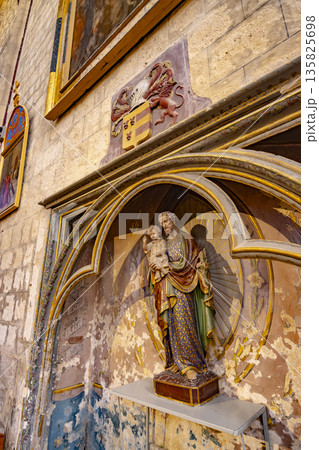 Saint Joseph and infant Jesus statue in church Saint Joseph and infant Jesus statue in church 135825698