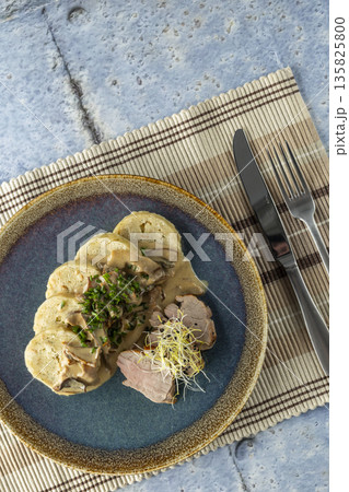 Pork tenderloin with mushroom sauce and bread dumplings Pork tenderloin with mushroom sauce and bread dumplings 135825800