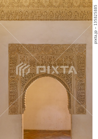Ornate archway with Arabic calligraphy, Alhambra, Granada, Spain 135825885