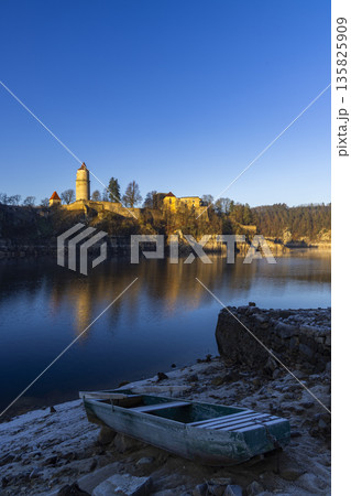Zvikov Castle reflecting in Vltava river with old boat Zvikov Castle reflecting in Vltava river with old boat 135825909