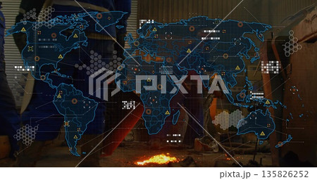 Displaying digital world map overlay with hazard data markers over molten metal on workshop floor Displaying digital world map overlay with hazard data markers over molten metal on workshop floor 135826252