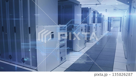 Server cabinets lining data center corridor showing network racks, circuit boards and glowing LEDs 135826287