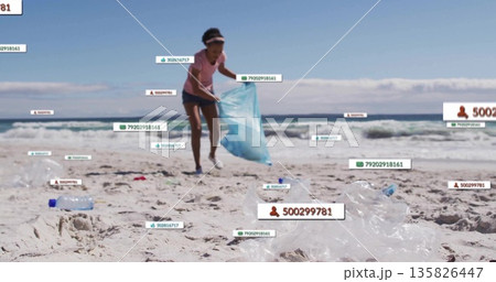 Woman in pink sportswear collecting debris on beach using blue trash bag, with digital count labels 135826447