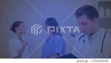 Doctor writing on clipboard in exam room, with lab coat, stethoscope and shelving unit, copy space Doctor writing on clipboard in exam room, with lab coat, stethoscope and shelving unit, copy space 135826449