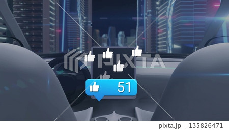 Displaying screen showing thumbs-up icons and like-count bubble by steering wheel in neon-lit cabin Displaying screen showing thumbs-up icons and like-count bubble by steering wheel in neon-lit cabin 135826471