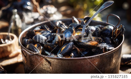Freshly steamed mussels are served from a large pot Freshly steamed mussels are served from a large pot 135827185
