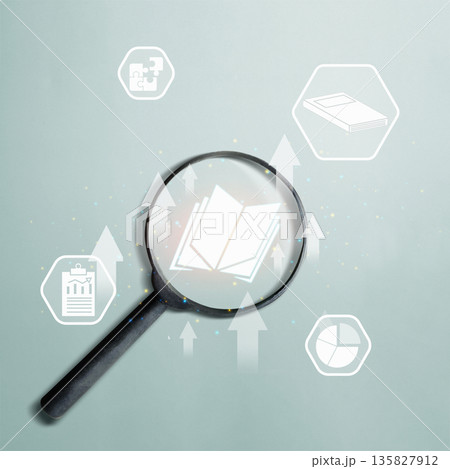 A magnifying glass focuses on an open book icon, surrounded by educational and business symbols representing research, data analysis, and the pursuit of knowledge 135827912