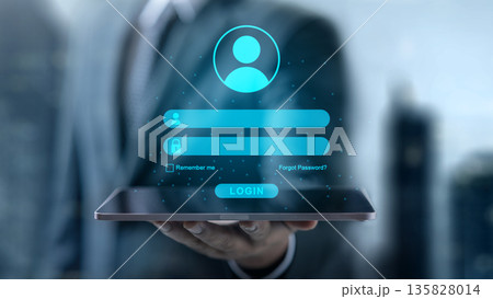 Cybersecurity and digital identity concept with a businessman holding a tablet displaying a virtual login interface for secure access and data protection Cybersecurity and digital identity concept with a businessman holding a tablet displaying a virtual login interface for secure access and data protection 135828014