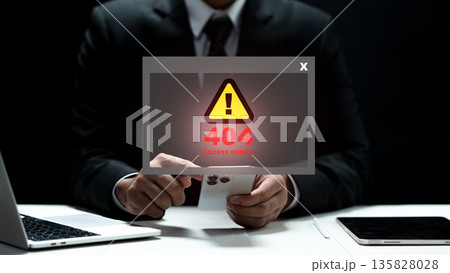 A professional man in a suit faces a digital 404 access denied warning on his smartphone. Concept of cybersecurity, server issues, and data protection failure in a modern office setting A professional man in a suit faces a digital 404 access denied warning on his smartphone. Concept of cybersecurity, server issues, and data protection failure in a modern office setting 135828028