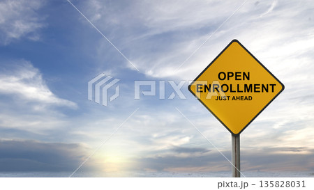 Conceptual yellow caution sign indicating Open Enrollment Just Ahead against a blue cloudy sky background, representing upcoming healthcare, insurance, or benefit selection periods 135828031